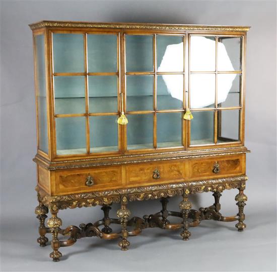 A 1930s Queen Anne revival walnut display cabinet, W.4ft 10in. D.1ft 4in. H.4ft 10.5in.